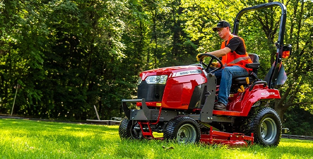 Woods equipment mid-mount finish mower attached to a Massey Ferguson sub-compact GC1700 series tractor.