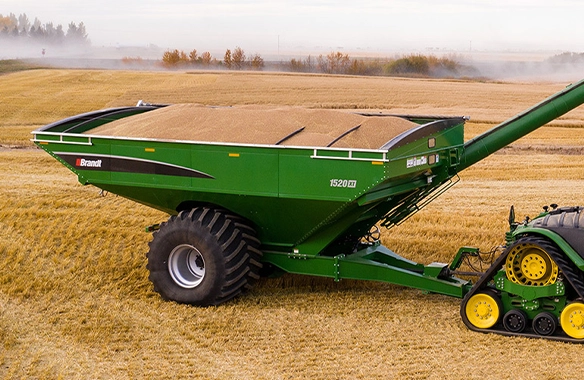 Thumbnail forBrandt 1520 XT grain cart with deep, high-capacity design and wide flotation tires, ideal for heavy field loads.