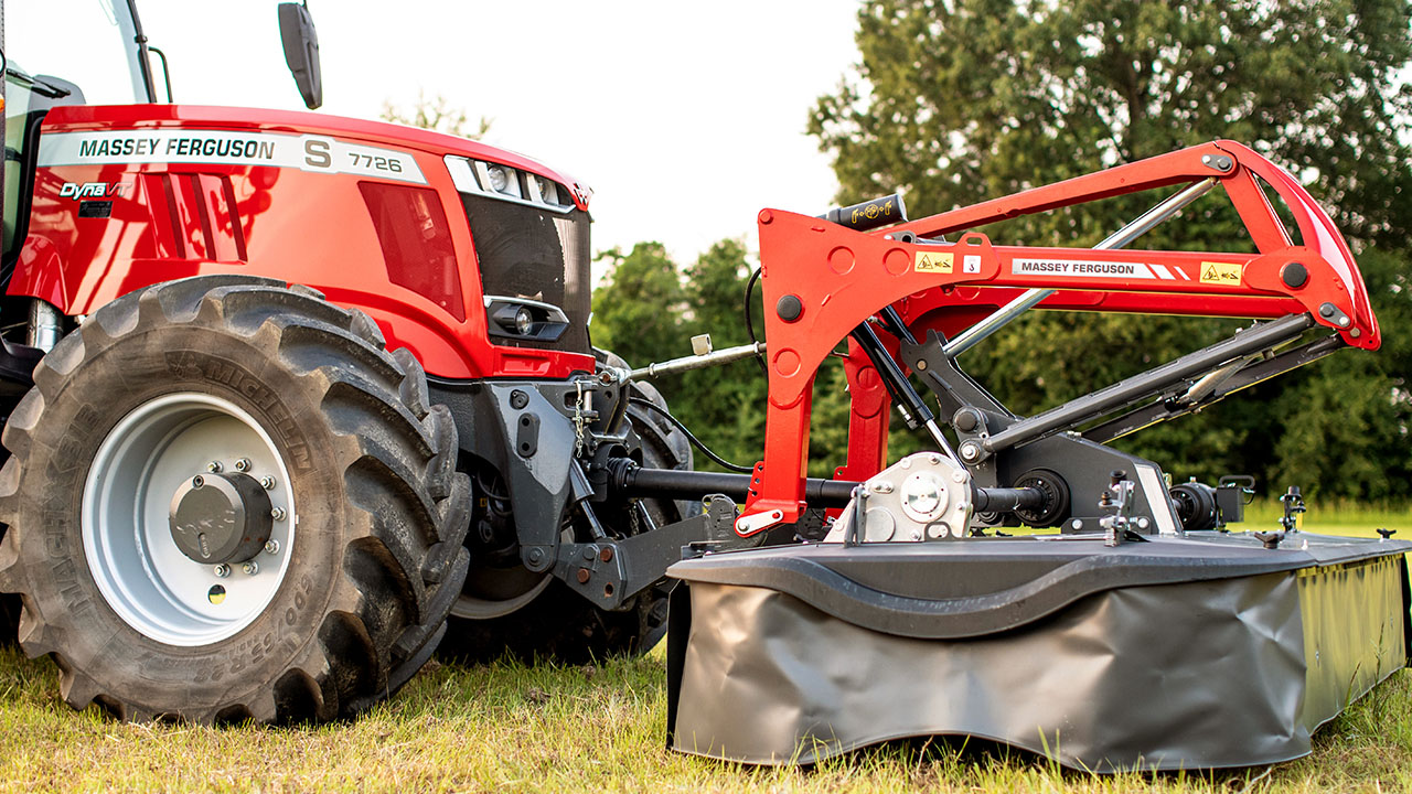 Close-up of Massey Ferguson tractor with MF DM Series Triple Mower front unit, built for high-efficiency mowing in all field conditions.