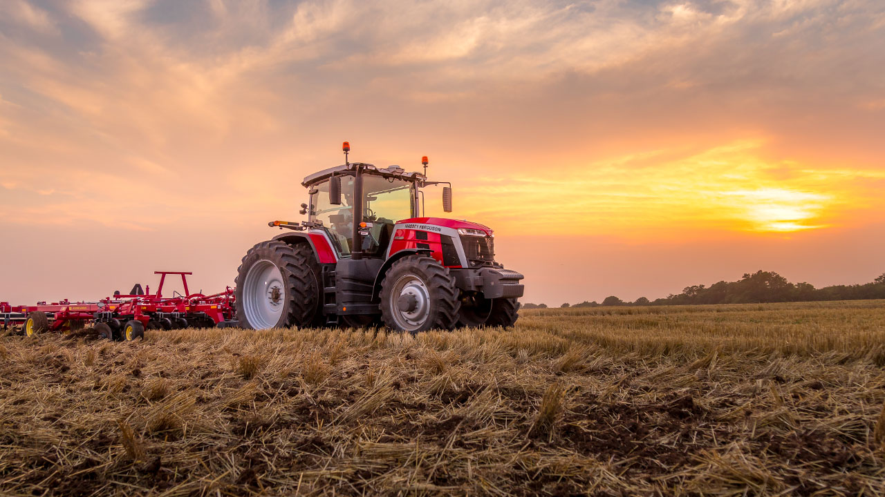 Massey Ferguson 8S Series tractor pulling Sunflower tillage equipment at sunset, built for power, precision, and field productivity.