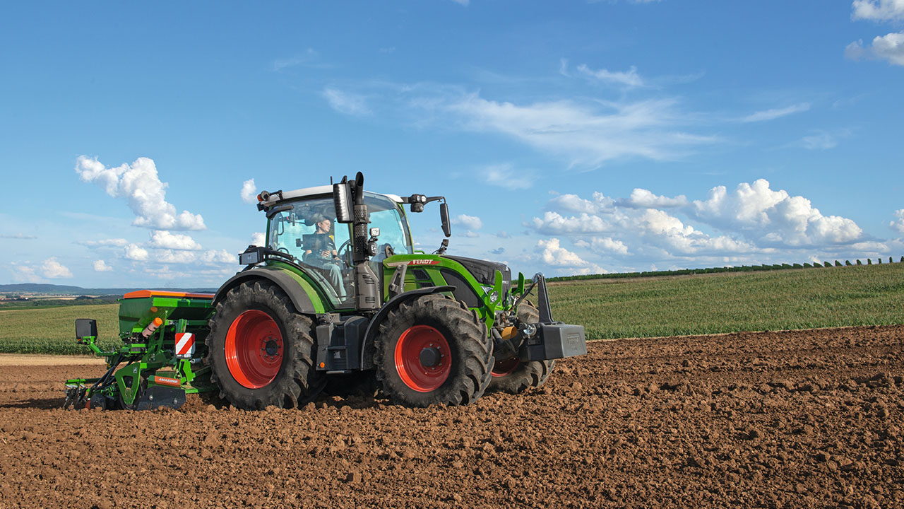 Fendt 500 Vario tractor working in tilled field, highlighting AGCO precision farming and planting equipment.
