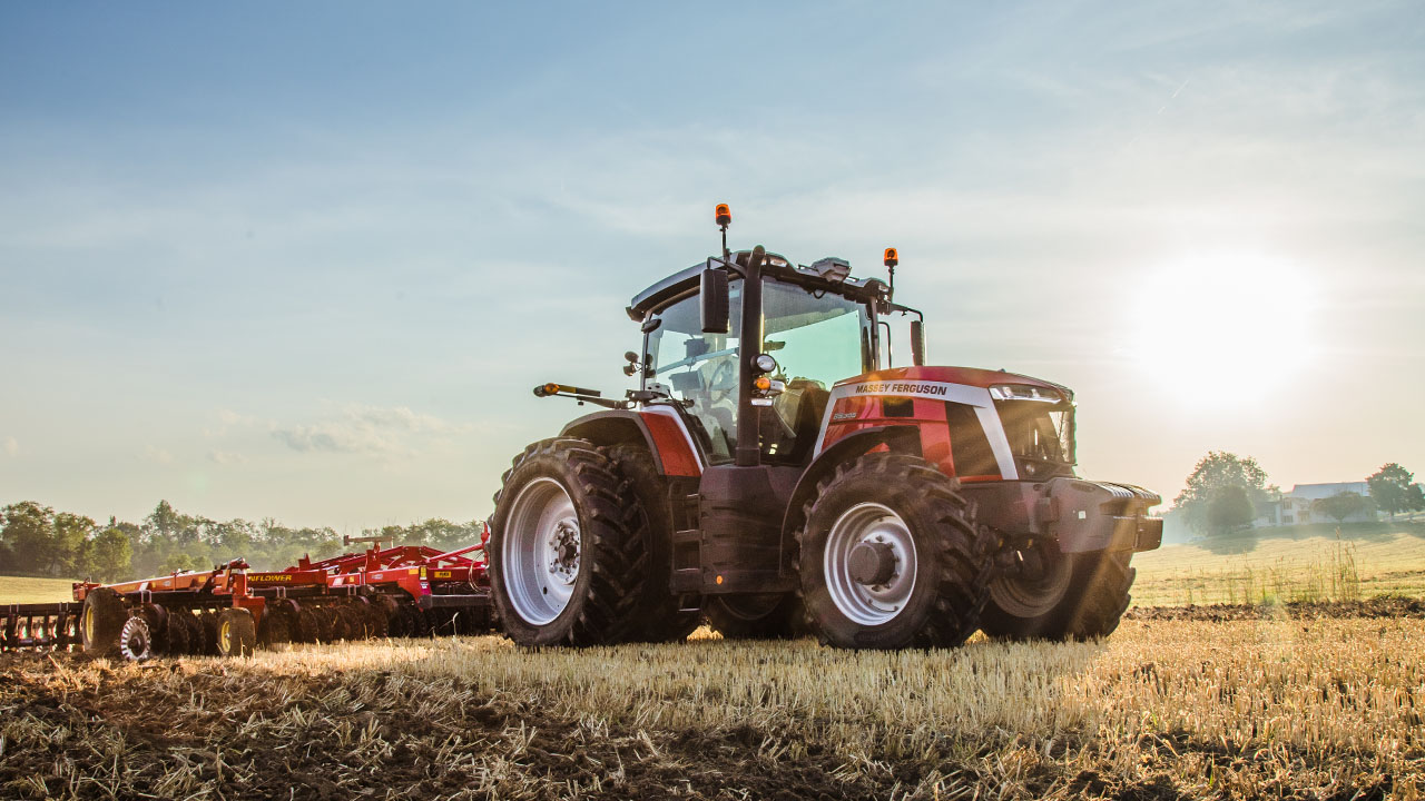 Massey Ferguson 8S Series tractor pulling Sunflower tillage equipment at sunrise, built for power, precision, and field productivity.