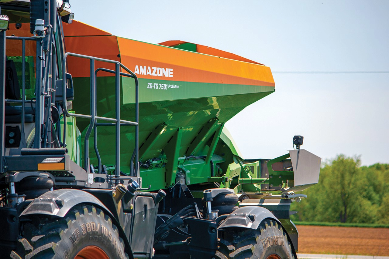 Close-up of an Amazone ZG-TS fertilizer spreader mounted on a Fendt Rogator, designed for precise and efficient nutrient application in agricultural fields.