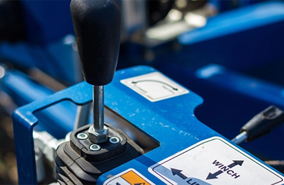 Ergonomic control lever on Brandt EZMover, allowing operators to quickly adjust auger position in the field.