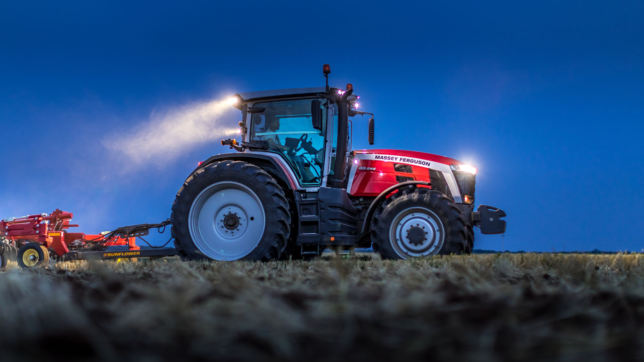 Massey Ferguson 8S Series tractor pulling Sunflower tillage equipment at dusk, built for power, precision, and field productivity.
