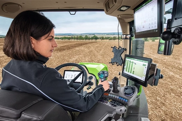 Fendt female tractor operator reviewing the data on her screen from Fendt Guide.