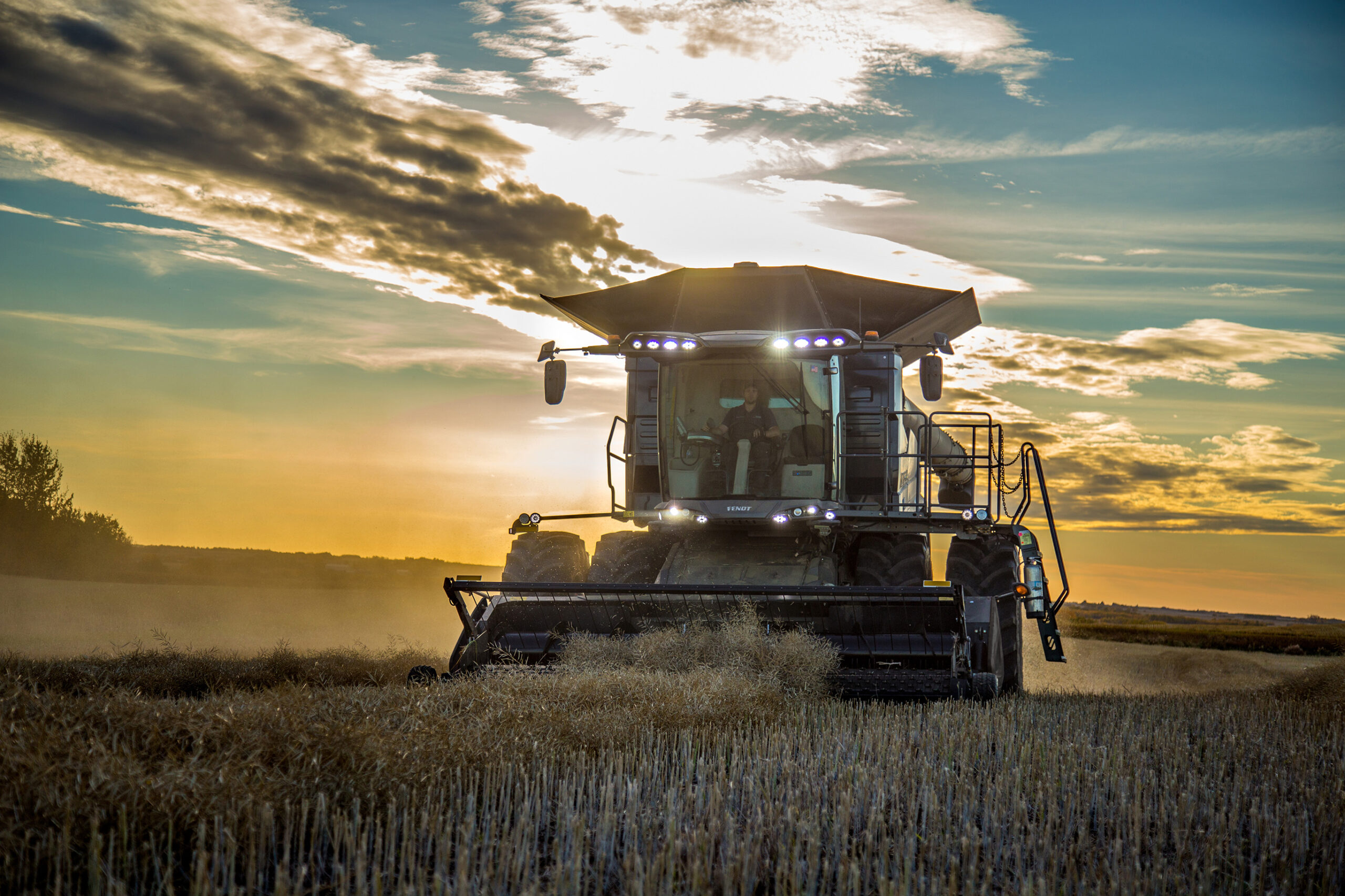 Fendt IDEAL combine harvesting corn, showcasing high-capacity grain tank and precision ag technology in action.